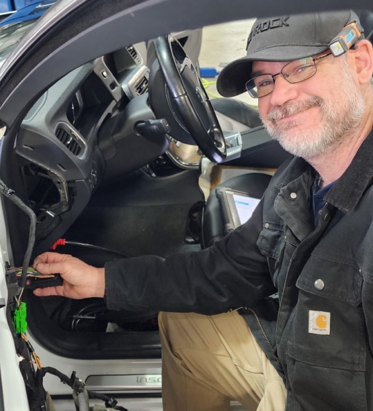 Pleasant Automotive auto repair careers in Wake Forest, NC. A man smiling at the camera