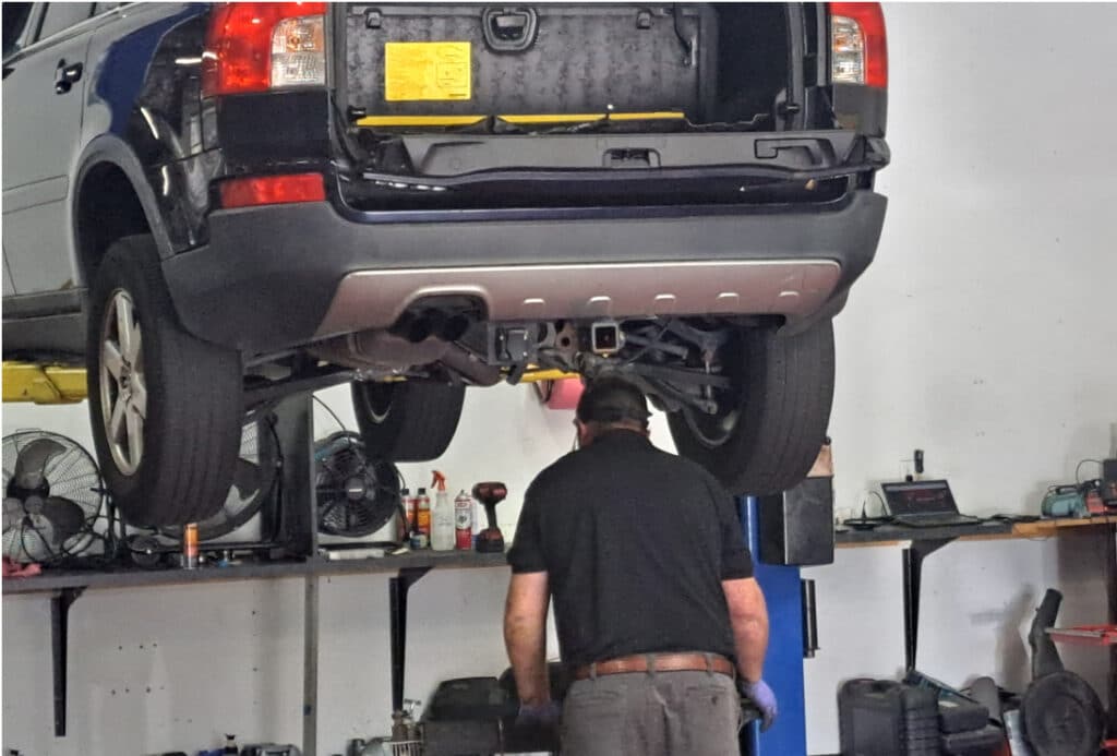 Pleasant Automotive auto repair in Wake Forest, NC. A man working on a car