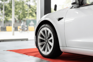 high-voltage battery, Auto Repair Services in Wake Forest, NC at Pleasant Automotive. A close-up image of a white Tesla car.