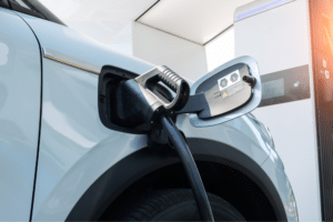 EV cold weather, Auto Repair Services in Wake Forest, NC at Pleasant Automotive. Image of an electric vehicle plugged into a charger.